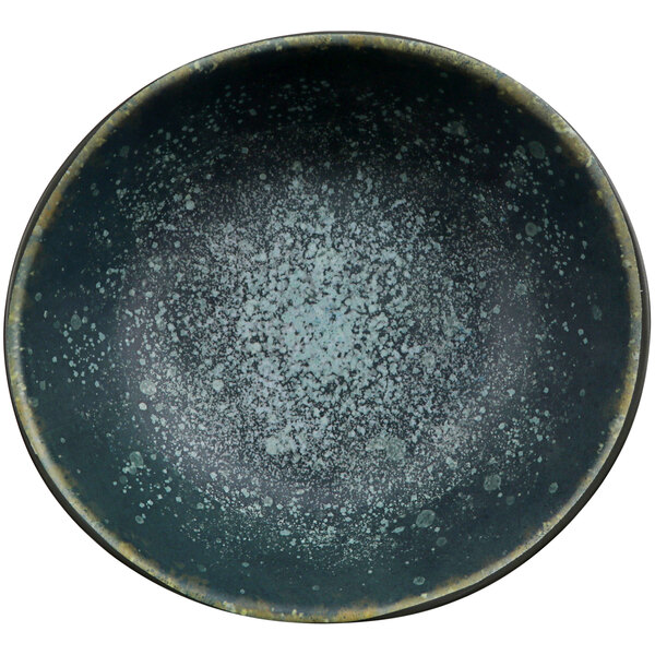A close up of a Cheforward Dusk and Spruce melamine bowl with a speckled black and blue surface.