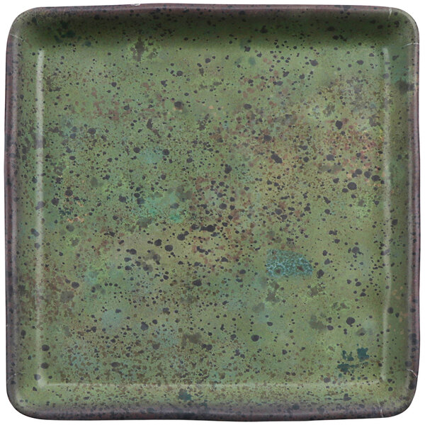 A green square cheforward by GET melamine plate with black specks.