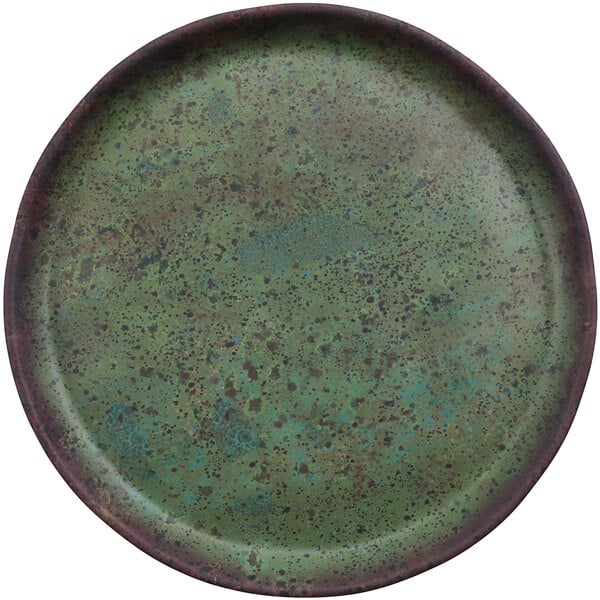 A green plate with brown speckles on it.
