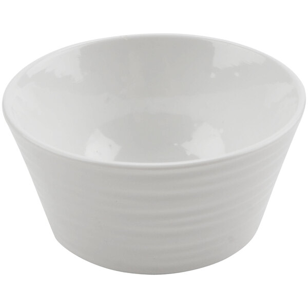 A white bowl with a curved edge on a white background.