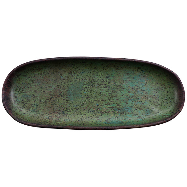 A green oval cheforward melamine platter with black specks.