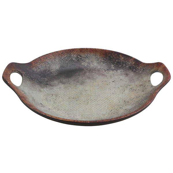 A close-up of a cheforward woven melamine wok plate.