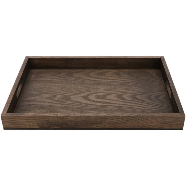 A GET Taproot ash wood serving tray with handles on a table.