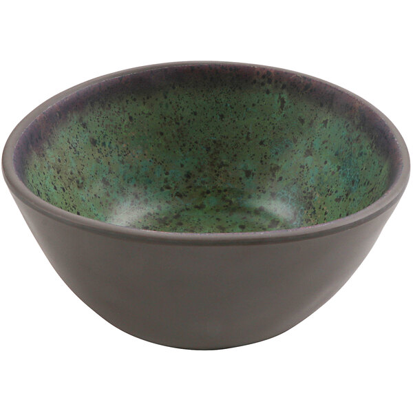 A green and black cheforward by GET Spruce melamine bowl on a table.