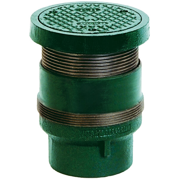 A green metal pipe with a round lid.