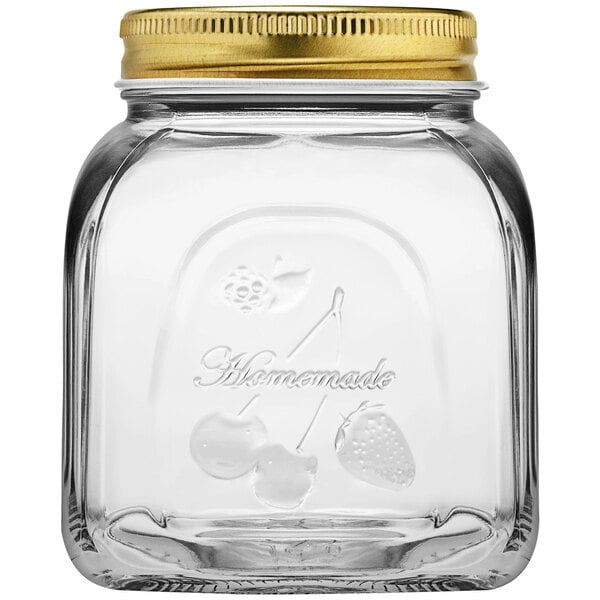 A clear glass Pasabahce Homemade jar with a gold lid.