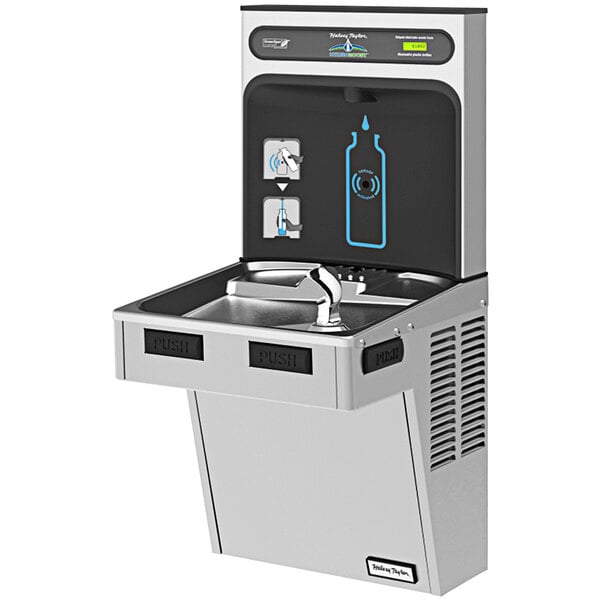 A stainless steel Halsey Taylor water fountain and bottle filler with a drink dispenser.