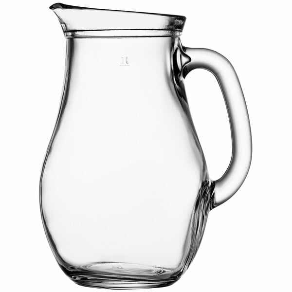 A Pasabahce clear glass pitcher with a handle.