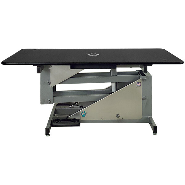 A black and silver Groomer's Best electric grooming table.