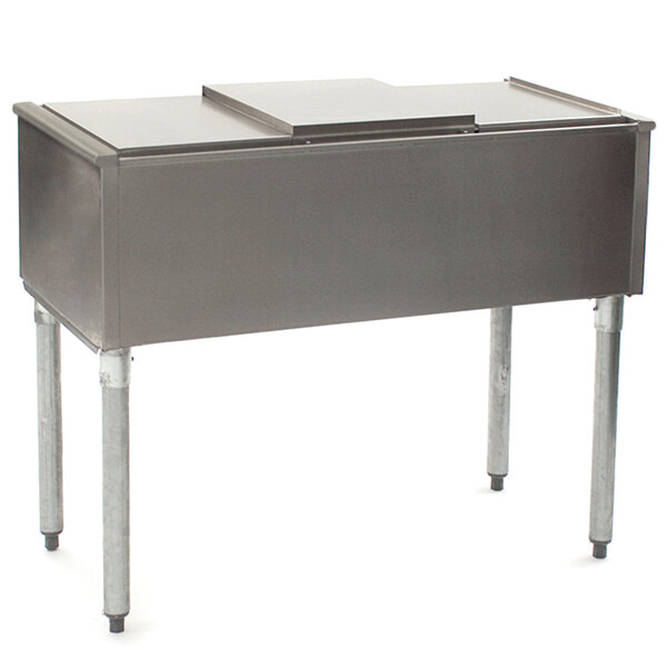 An Eagle Group Pass-Through Ice Chest on a stainless steel counter.