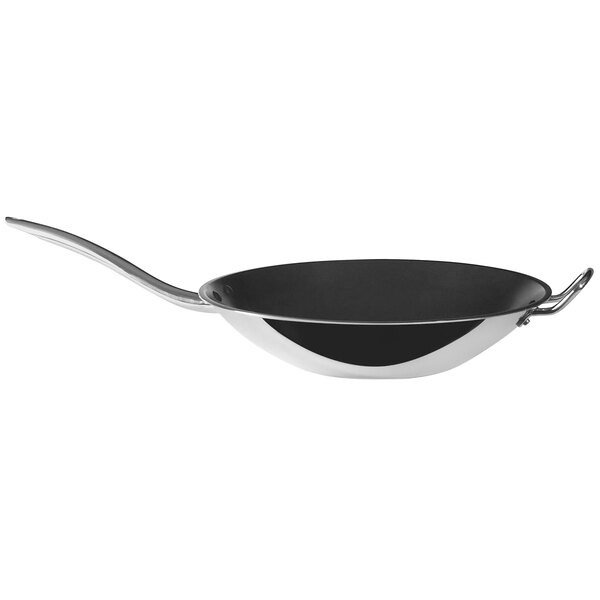 A black and silver Spring USA Vulcano wok with a long handle.