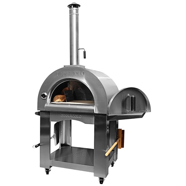 A silver metal Pinnacolo wood-fired pizza oven on a metal stand with wood inside.
