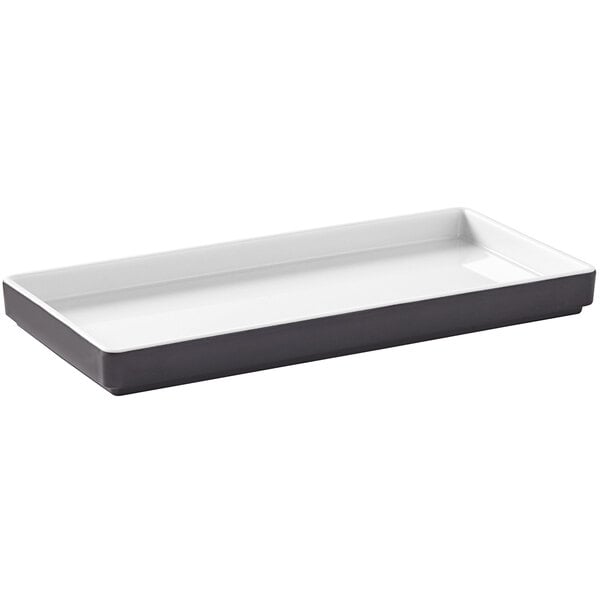 A white rectangular tray with a black design.