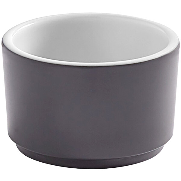 An American Metalcraft graphite melamine sauce cup with a white rim.