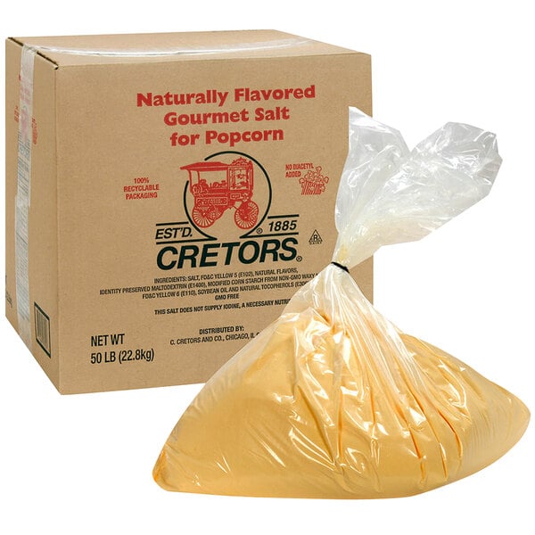 A box of Cretors butter-flavored gourmet salt next to a bag of popcorn.