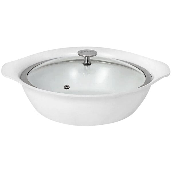 A white Spring USA round casserole pan with a glass lid.