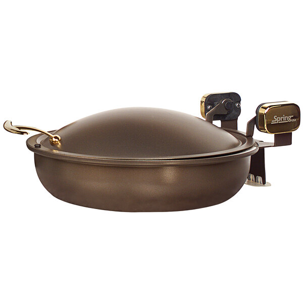 A brown round Spring USA chafer pan with a lid.