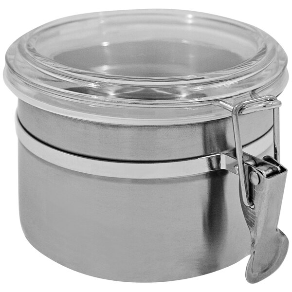 A Spring USA stainless steel canister with a clear lid and metal handle.