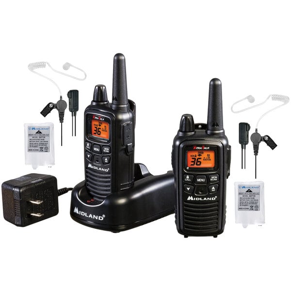 A black Midland walkie talkie set with earbuds and charger.