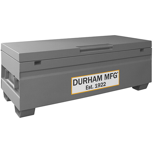 A grey Durham Mfg job site box with a white label.