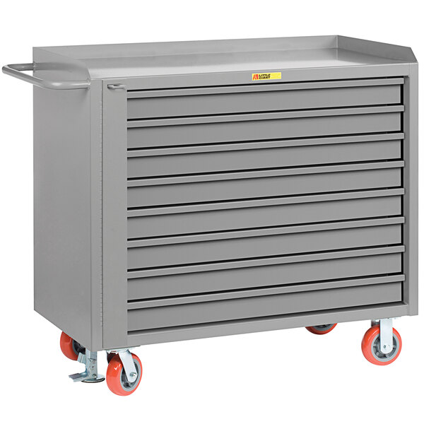 A gray Little Giant mobile tool cabinet with red wheels.