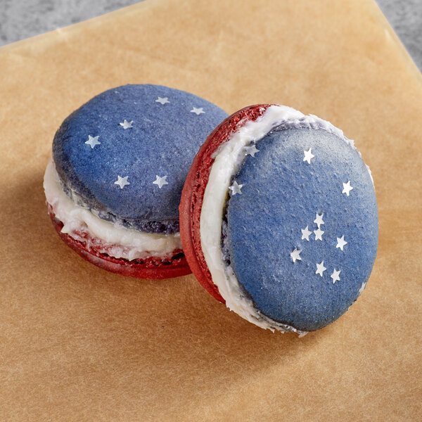Two Macaron Centrale macarons with stars on them.