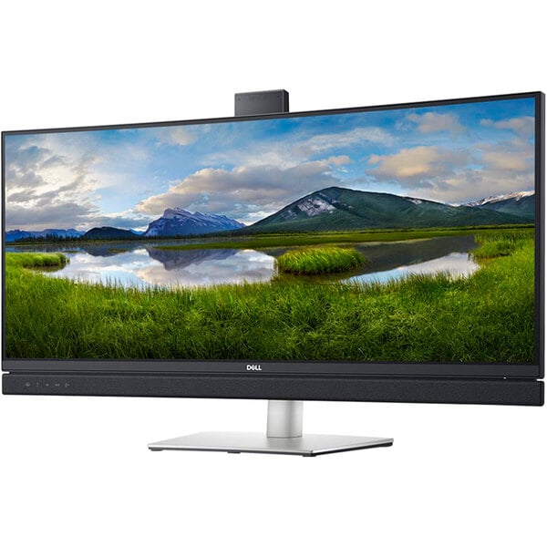 A Dell curved ultrawide monitor with a landscape on the screen.