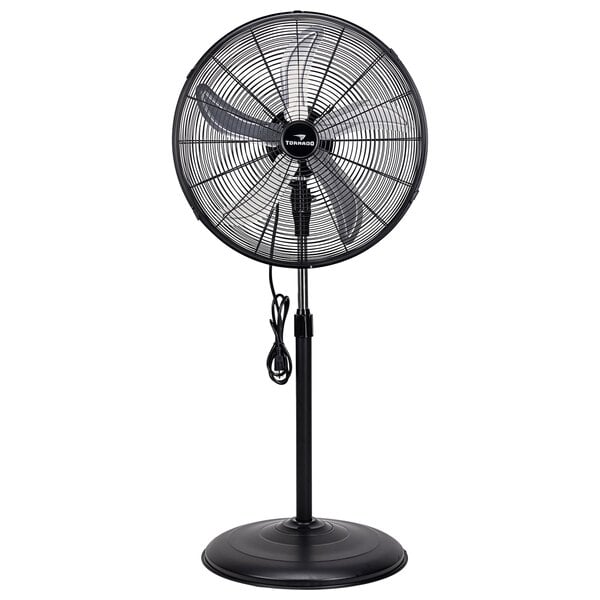 A Tornado industrial pedestal fan with a black pole and cord.