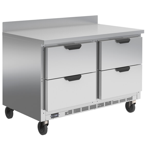A stainless steel Beverage-Air worktop freezer with four drawers on wheels.