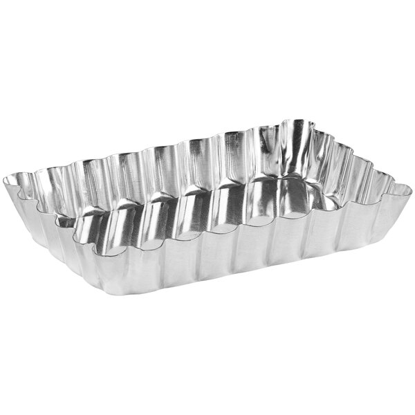 A Gobel rectangular tin-plated steel tartlet pan with fluted edges.