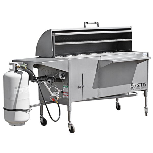 A Holstein Manufacturing stainless steel propane grill with a gas tank and hose attached.