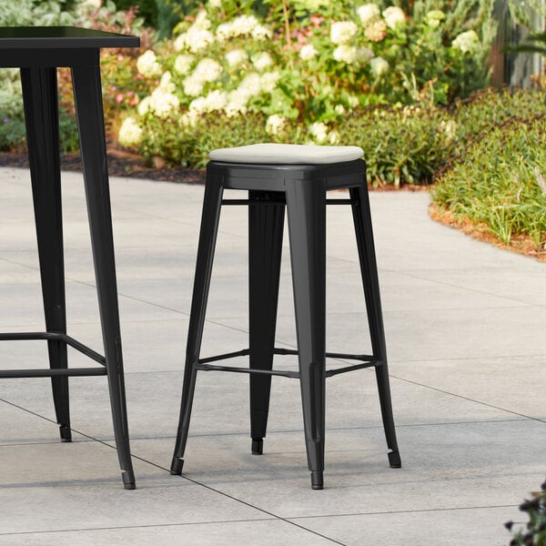 Lancaster Table & Seating Alloy Series Onyx Black Outdoor Backless Barstool with Tan Fabric Magnetic Cushion