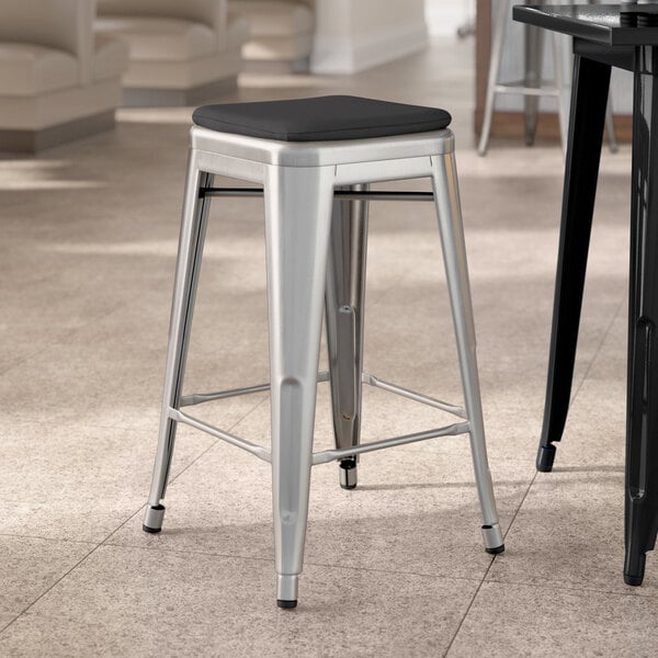 Lancaster Table & Seating Alloy Series Clear Coat Indoor Backless Counter Height Stool with Black Fabric Magnetic Cushion