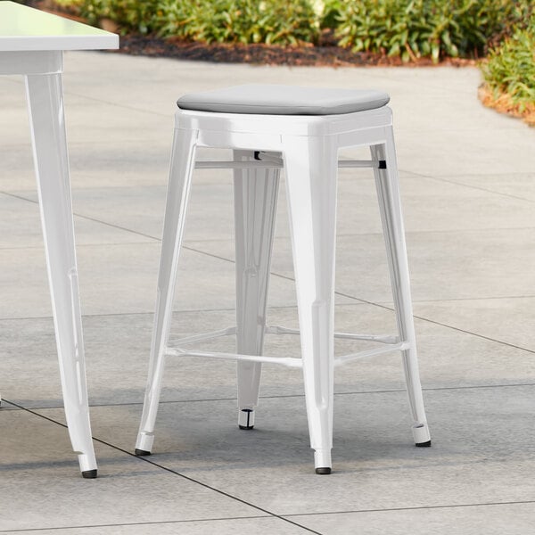 Lancaster Table & Seating Alloy Series Pearl White Outdoor Backless Counter Height Stool with Gray Fabric Magnetic Cushion