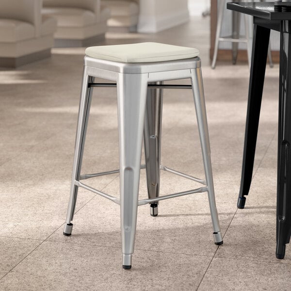Lancaster Table & Seating Alloy Series Clear Coat Indoor Backless Counter Height Stool with Tan Fabric Magnetic Cushion