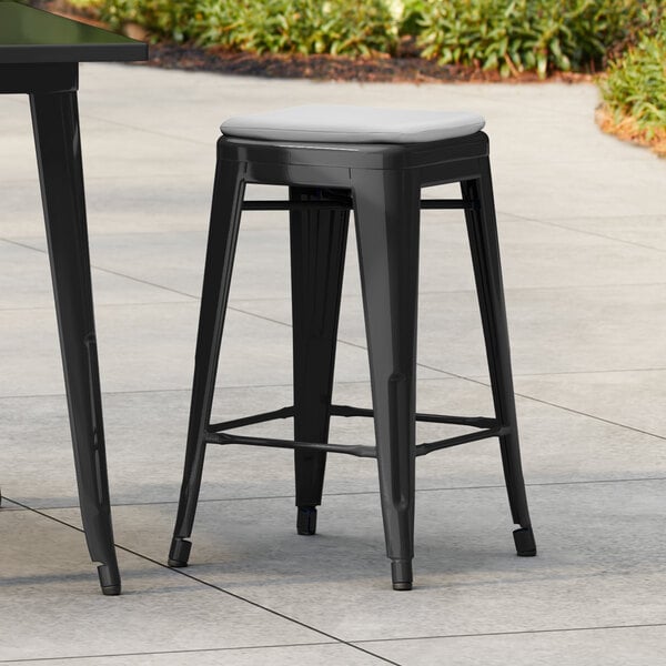 Lancaster Table & Seating Alloy Series Onyx Black Outdoor Backless Counter Height Stool with Gray Fabric Magnetic Cushion