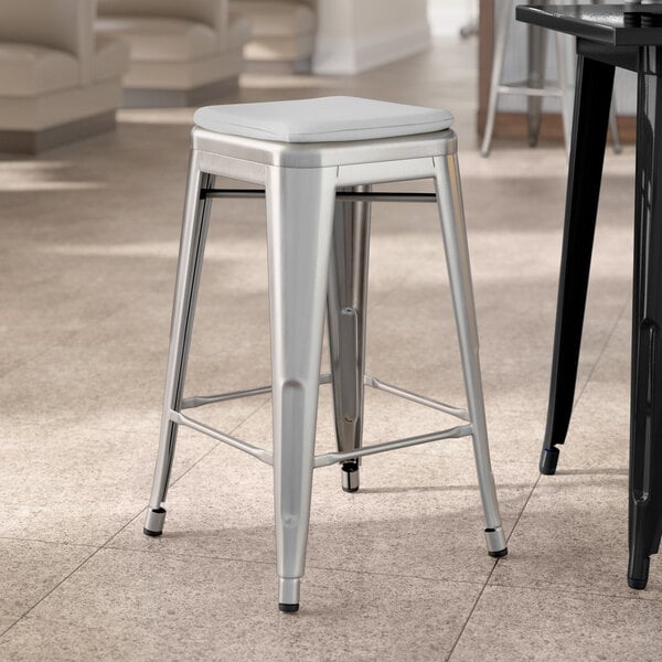 Lancaster Table & Seating Alloy Series Clear Coat Indoor Backless Counter Height Stool with Gray Fabric Magnetic Cushion