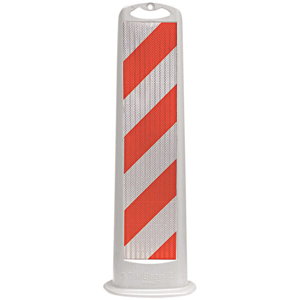 A white vertical parking lot sign with orange and white stripes.