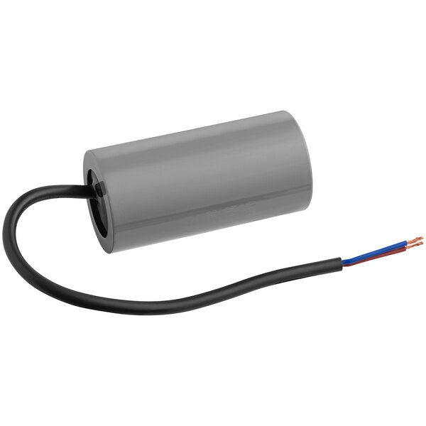 A grey cylinder with black and white electrical wires.