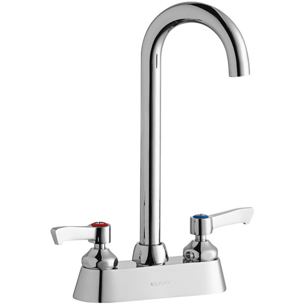 A silver Elkay deck-mount faucet with two lever handles.