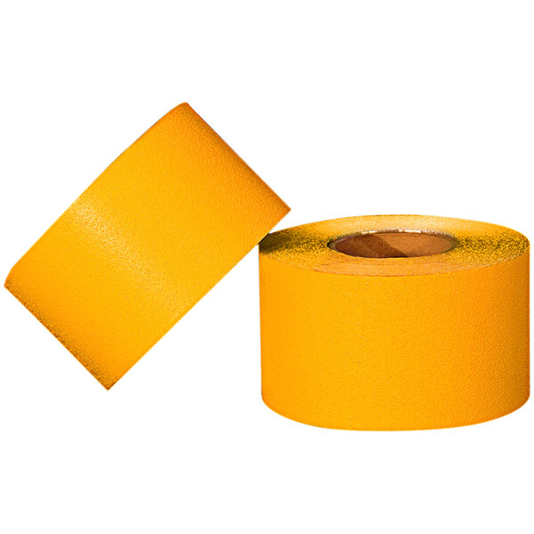 Two yellow rolls of Cortina temporary pavement marking tape on a white background.