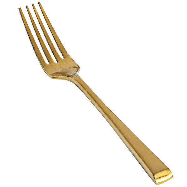 A close-up of a Front of the House Parker 18/10 stainless steel matte brass salad/dessert fork with a yellow tint.