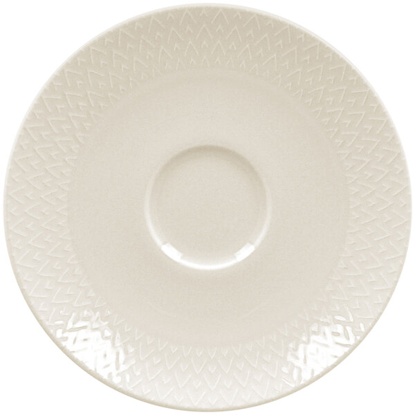 A white RAK Porcelain saucer with a circular edge and a pattern.