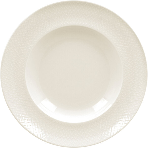 A close up of a RAK Porcelain ivory deep plate with an embossed pattern.