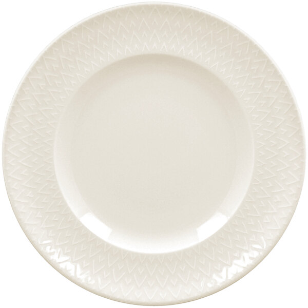 A close up of a RAK Porcelain ivory flat plate with an embossed pattern.