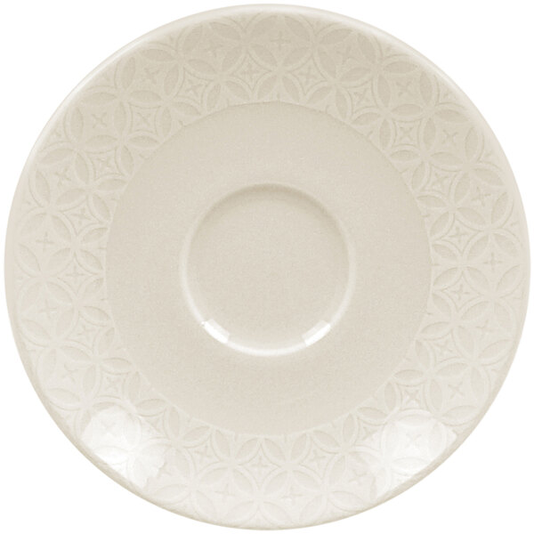 A white RAK Porcelain saucer with an embossed design.