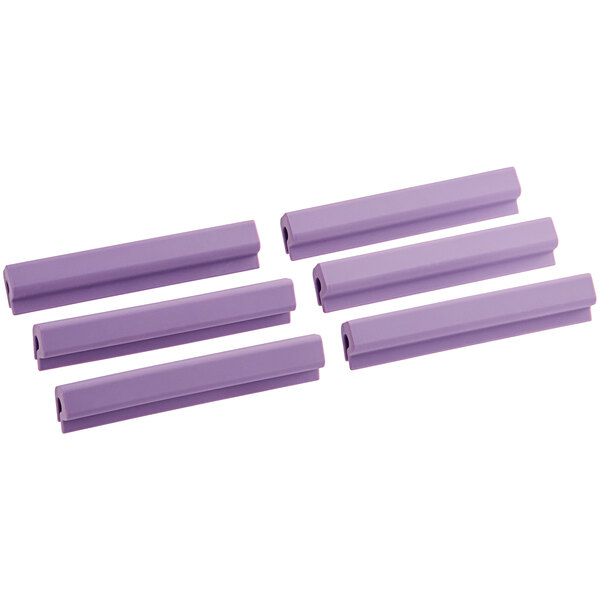 A group of four purple plastic clips.