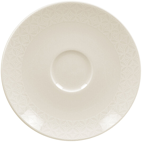 A white RAK Porcelain saucer with a circular lace pattern.
