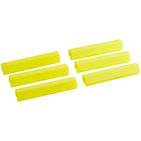 A group of yellow silicone Baker's Mark bun / sheet pan clips.