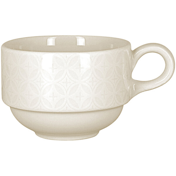 A RAK Porcelain ivory teacup with an embossed lace design and a handle.